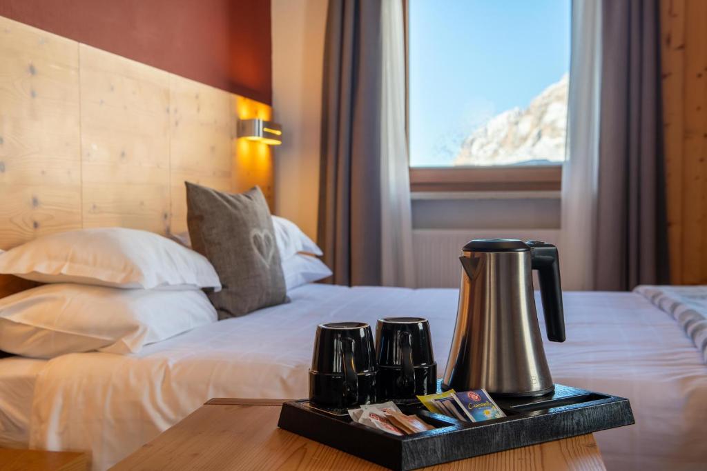 Postel nebo postele na pokoji v ubytování Hotel Col di Lana