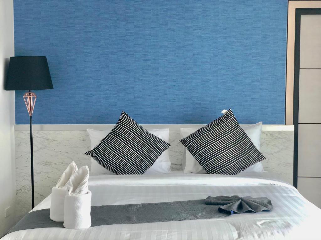Postel nebo postele na pokoji v ubytování Irin Beach Cha-am