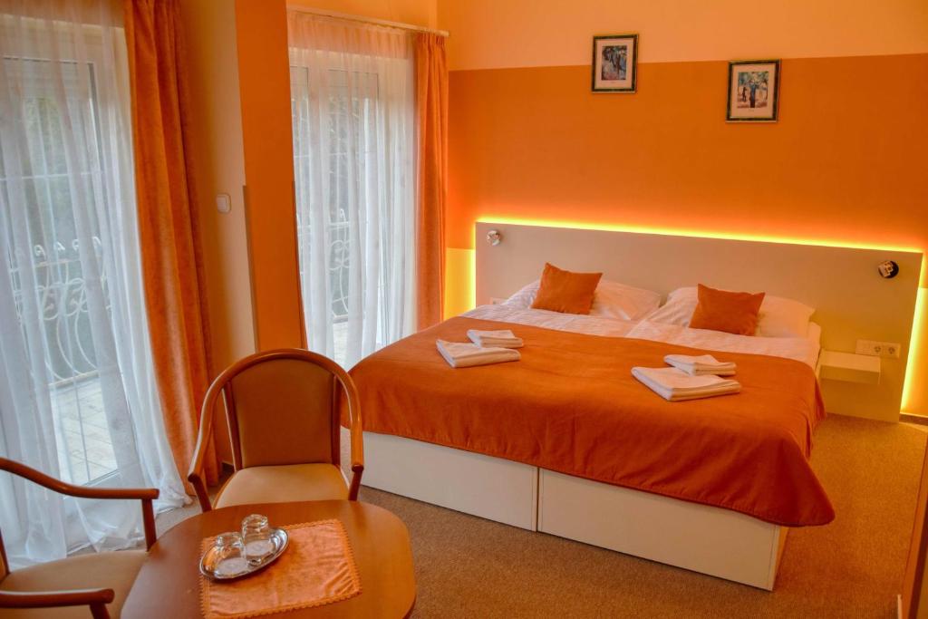 Postel nebo postele na pokoji v ubytování Hotel Penta Lux