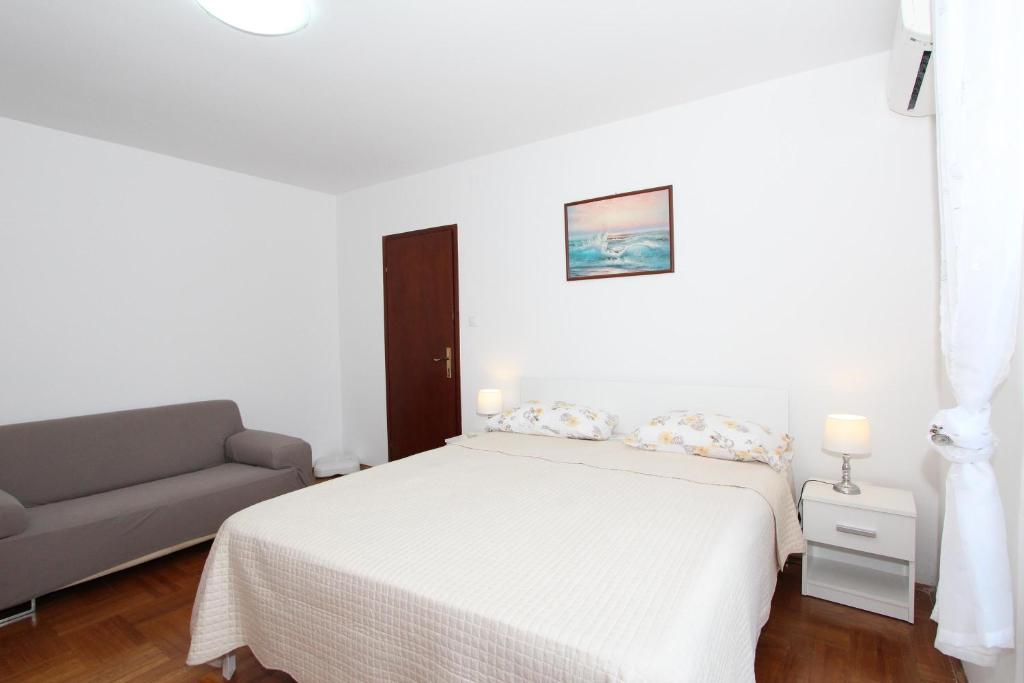 Łóżko lub łóżka w pokoju w obiekcie Apartment Gabriel