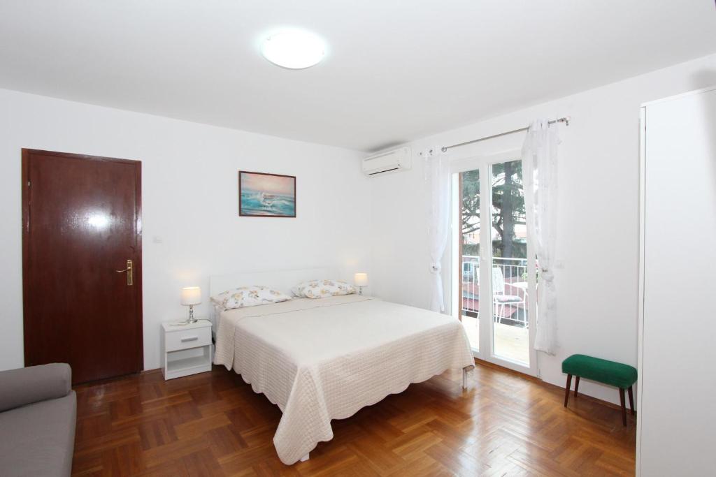 Łóżko lub łóżka w pokoju w obiekcie Apartment Gabriel