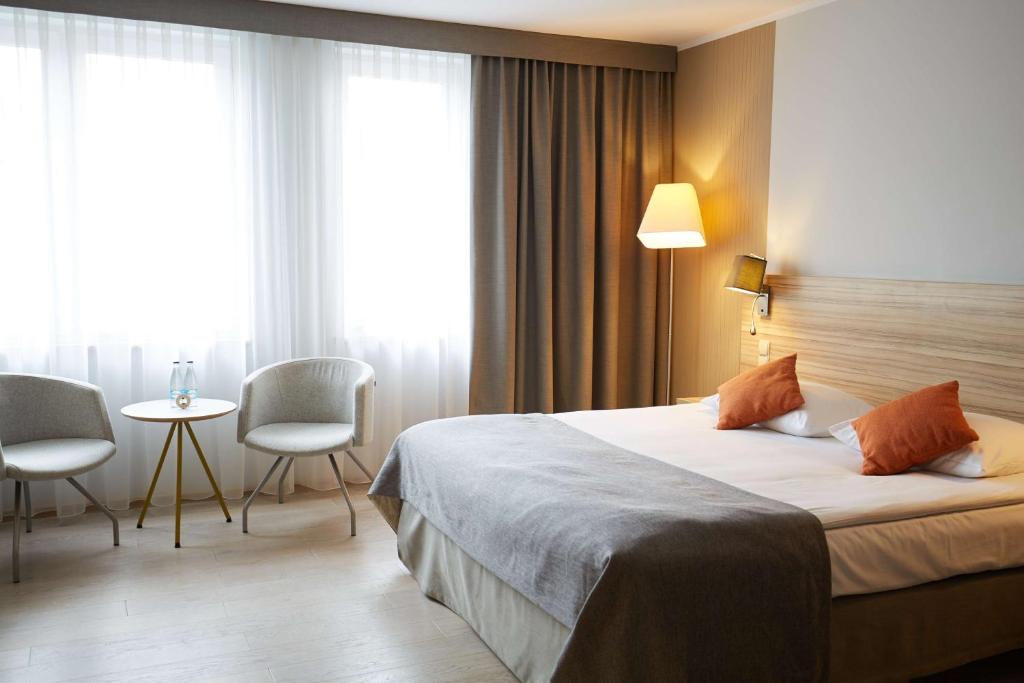 Łóżko lub łóżka w pokoju w obiekcie Scandic Wroclaw