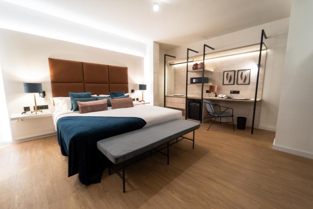a large bedroom with a large bed and a desk at Hotel Taburiente S.C.Tenerife in Santa Cruz de Tenerife