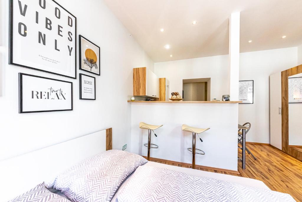 A kitchen or kitchenette at COZY + TRENDY by JR City Apartments