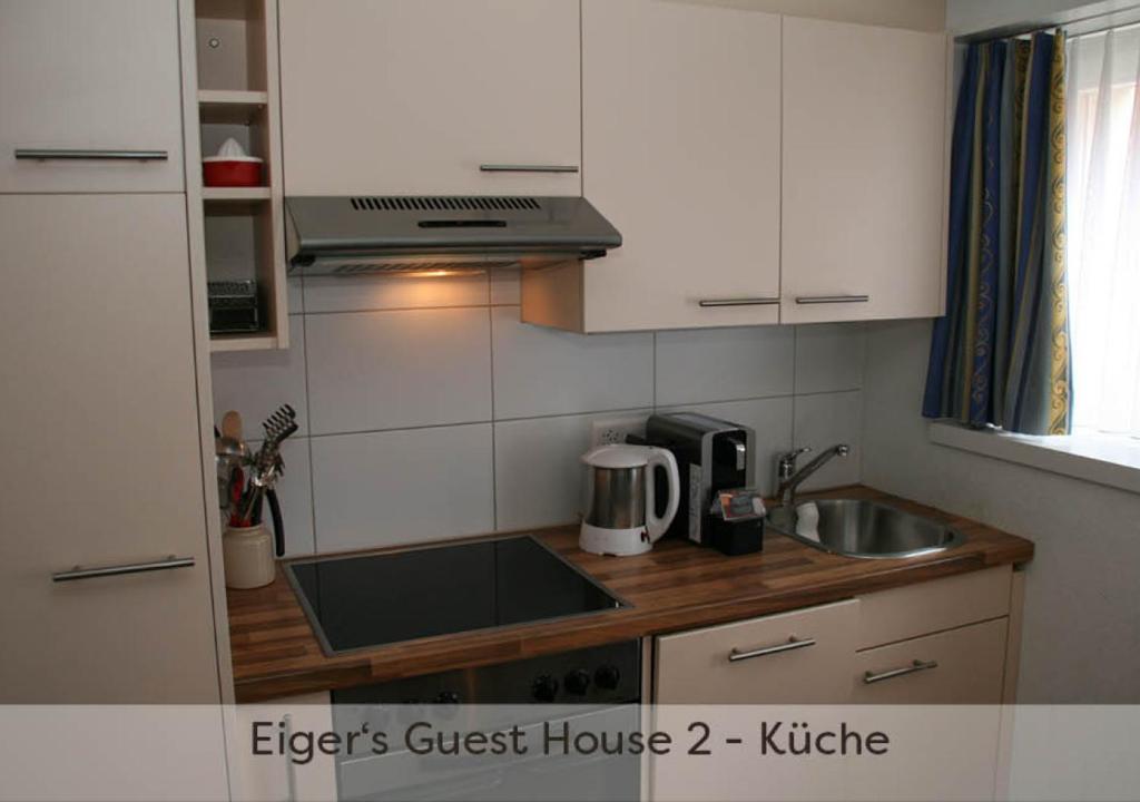 Kuchyň nebo kuchyňský kout v ubytování Eiger Guest House - Grindelwald