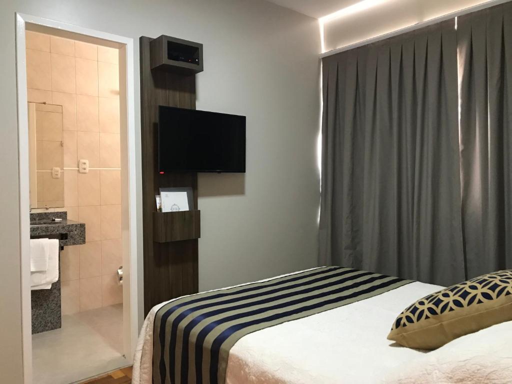 Postel nebo postele na pokoji v ubytování Hotel Requinte