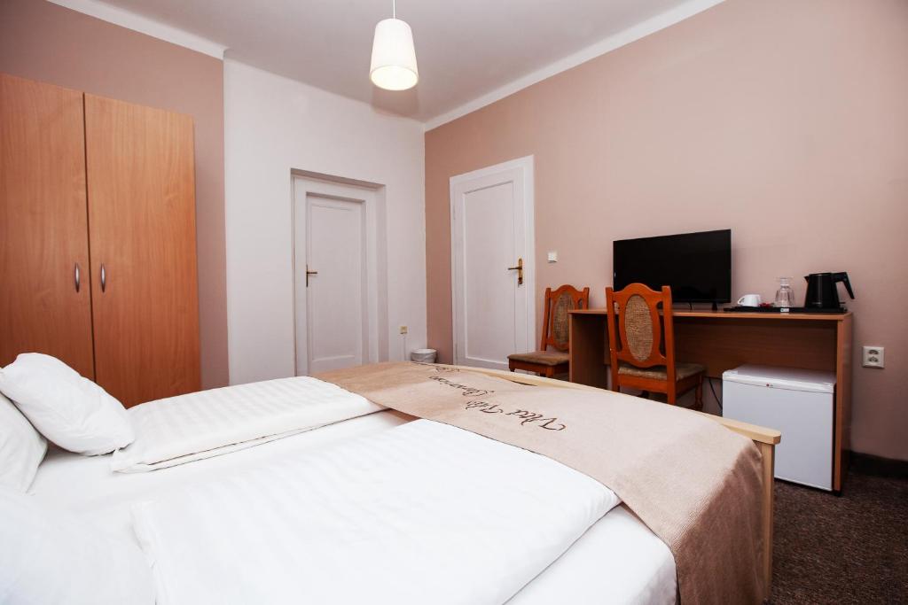 Postel nebo postele na pokoji v ubytování Apartmány Rossini