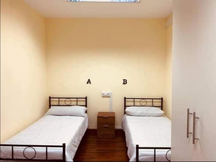 A bed or beds in a room at El cordal de laciana