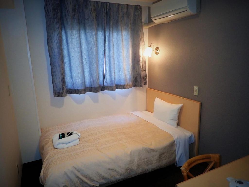 Llit o llits en una habitació de Hotel Suntargas Ueno - Vacation STAY 08474v