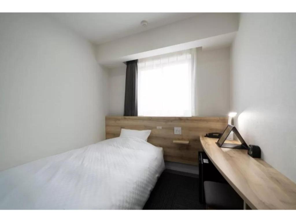 Posteľ alebo postele v izbe v ubytovaní R&B Hotel Nagoya Shinkansenguchi - Vacation STAY 14999v