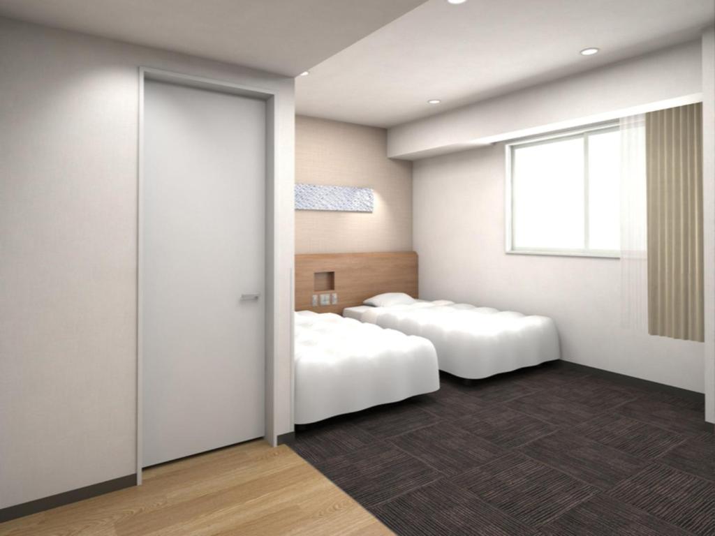 a bedroom with two beds and a window at R&B Hotel Nagoya Ekimae - Vacation STAY 15188v in Nagoya