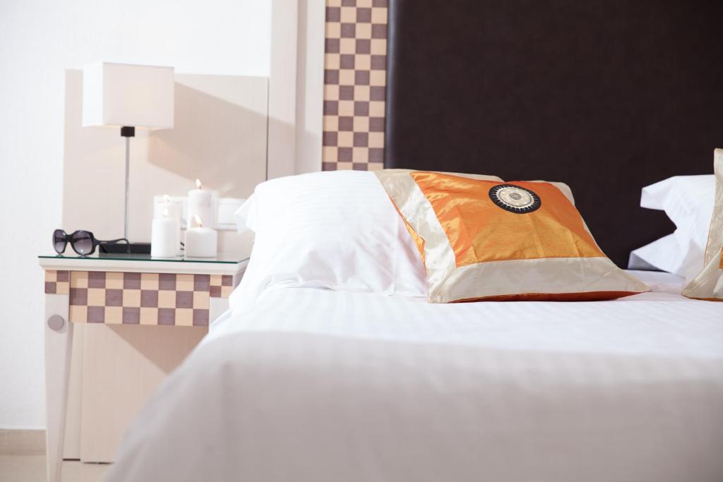 Postel nebo postele na pokoji v ubytování Domna Hotel