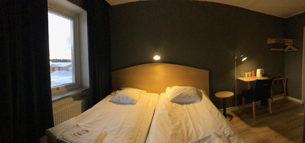 Postel nebo postele na pokoji v ubytování Hotel Lapland River