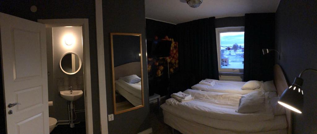 Postel nebo postele na pokoji v ubytování Hotel Lapland River