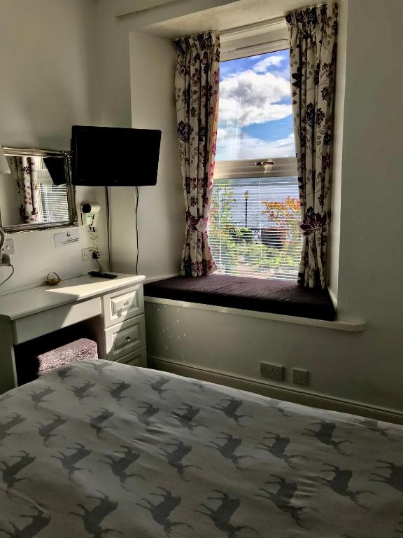 Postel nebo postele na pokoji v ubytování Culag Lochside Self Catering