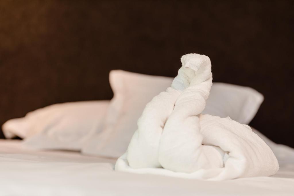 Postel nebo postele na pokoji v ubytování Labirint Boutique Hotel