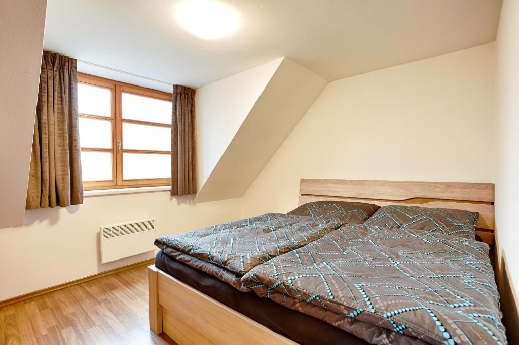 Postel nebo postele na pokoji v ubytování Horský apartmán U Lesa Říčky