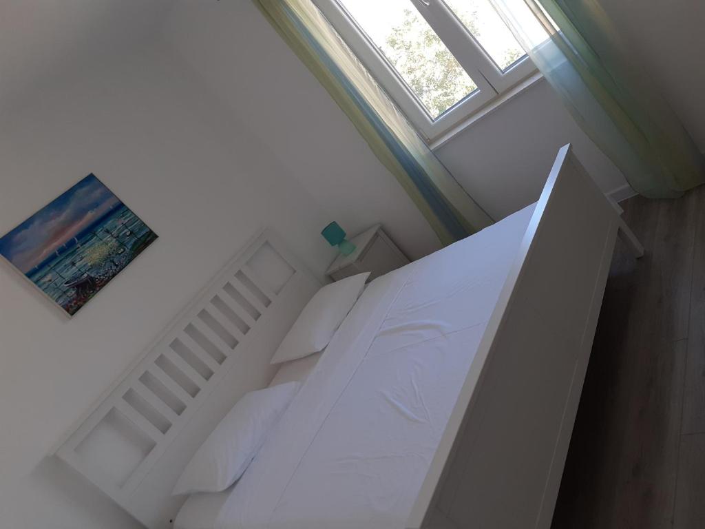 Postel nebo postele na pokoji v ubytování Apartman Jasa