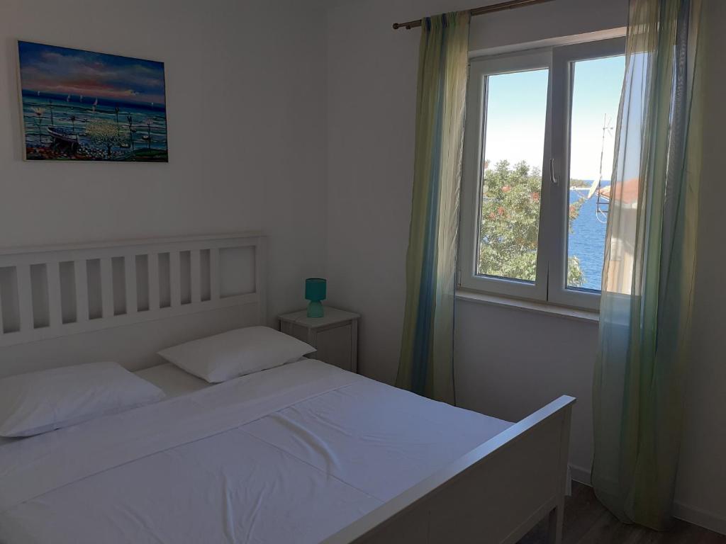 Postel nebo postele na pokoji v ubytování Apartman Jasa