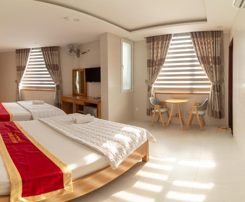Giường trong phòng chung tại Lam Kiều Hotel