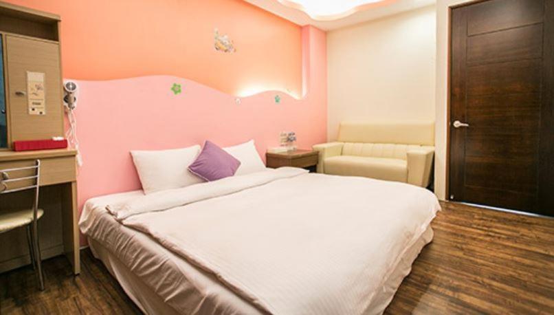 Postel nebo postele na pokoji v ubytování Kenting Mulan Homestay