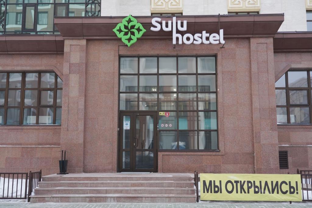 a building with a suntrust sign on top of it at Sulu Hostel in Astana