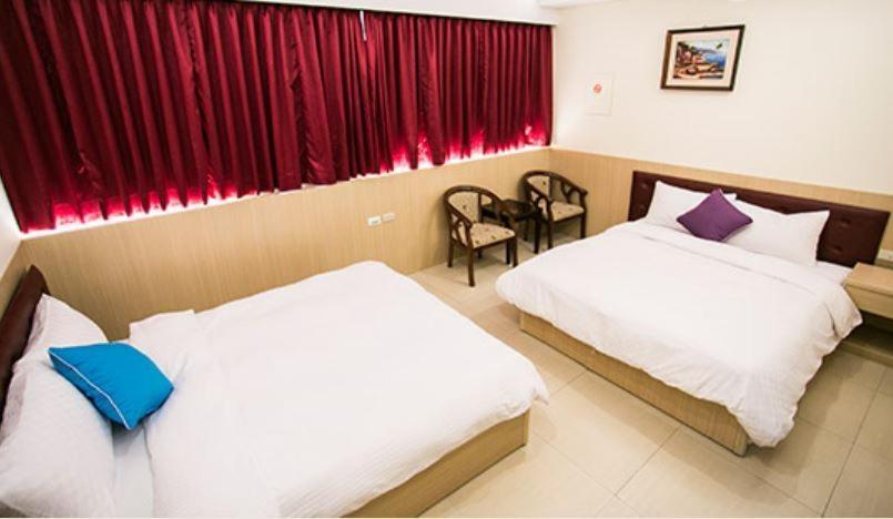 Postel nebo postele na pokoji v ubytování Kenting Mulan Homestay