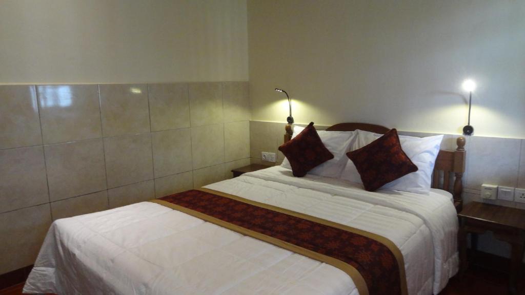 Postel nebo postele na pokoji v ubytování Sunarta House Homestay