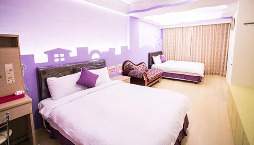 Postel nebo postele na pokoji v ubytování Kenting Mulan Homestay