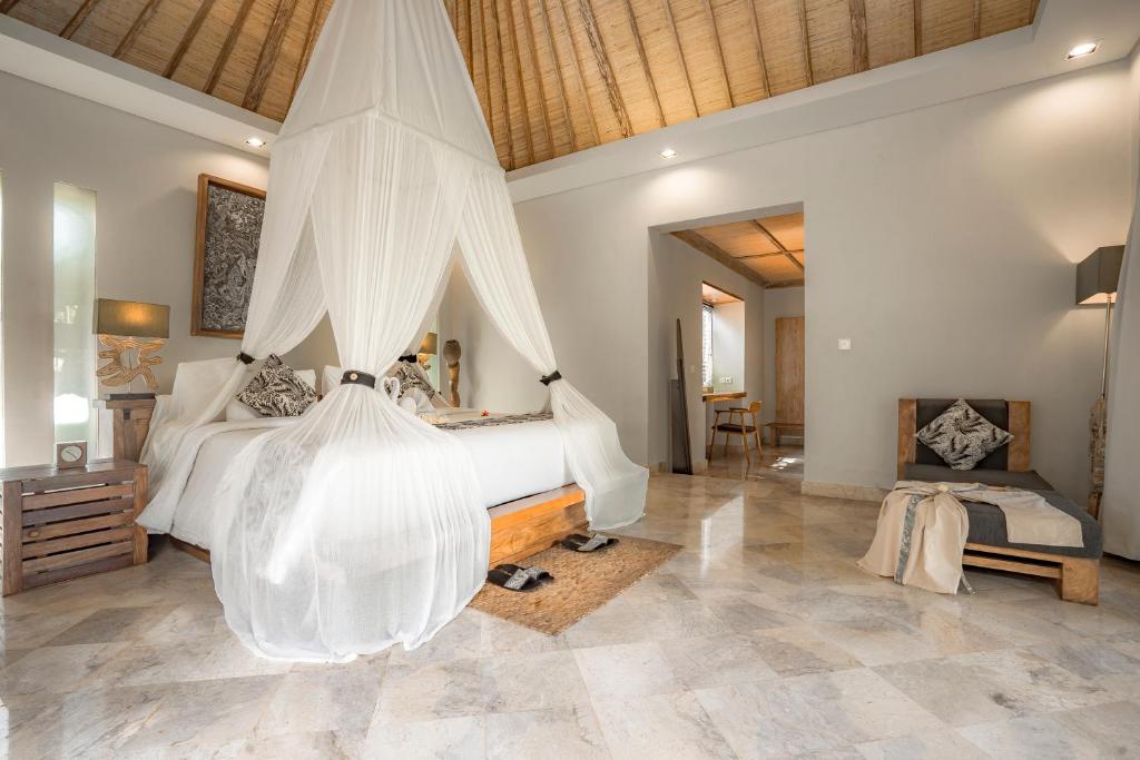 Postel nebo postele na pokoji v ubytování KajaNe Mua at Ubud Bali