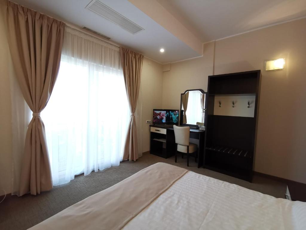 Postel nebo postele na pokoji v ubytování Hotel New Derby