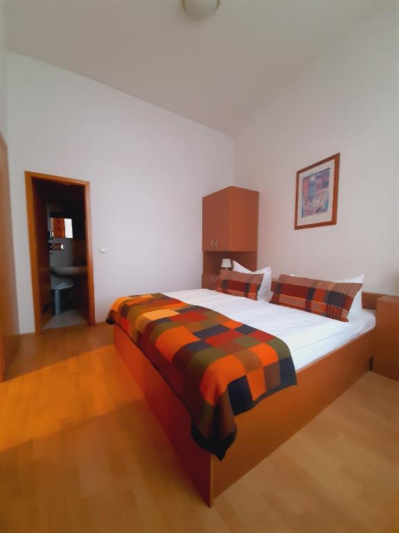 Postel nebo postele na pokoji v ubytování Altwernigeröder Apparthotel