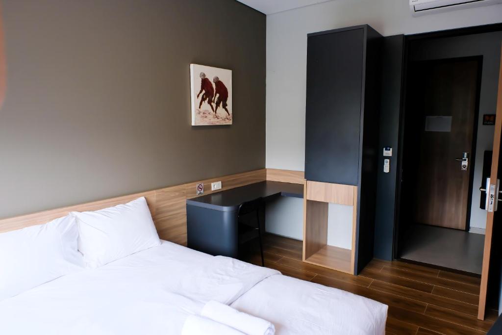 Postel nebo postele na pokoji v ubytování M Studio Karawaci