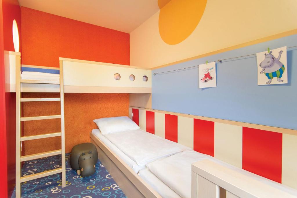 Postel nebo postele na pokoji v ubytování Kolping Family Resort