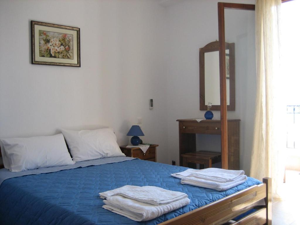 Posteľ alebo postele v izbe v ubytovaní Ammos Studios and Apartments