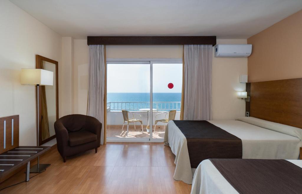a hotel room with a view of the ocean at Rincón Sol in Rincón de la Victoria