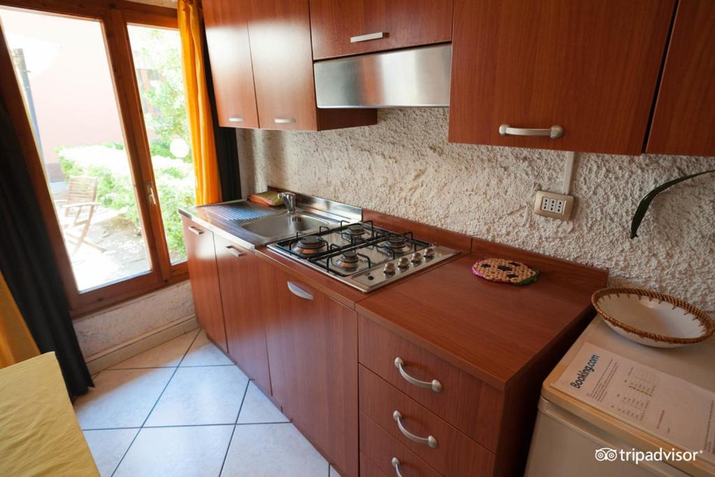 Kuchyň nebo kuchyňský kout v ubytování Solemare Accommodation Alghero