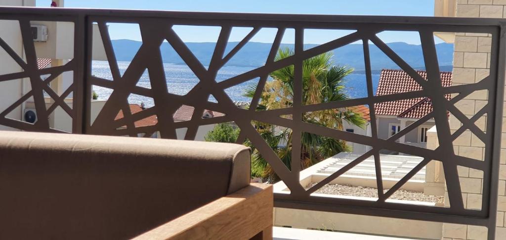 a view of the ocean from a balcony at L & L Apartmani in Bol