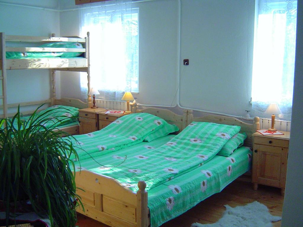 Postel nebo postele na pokoji v ubytování Cserekert, Alszegi Porta
