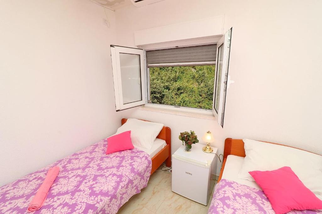 Łóżko lub łóżka w pokoju w obiekcie Apartment Belin Mljet