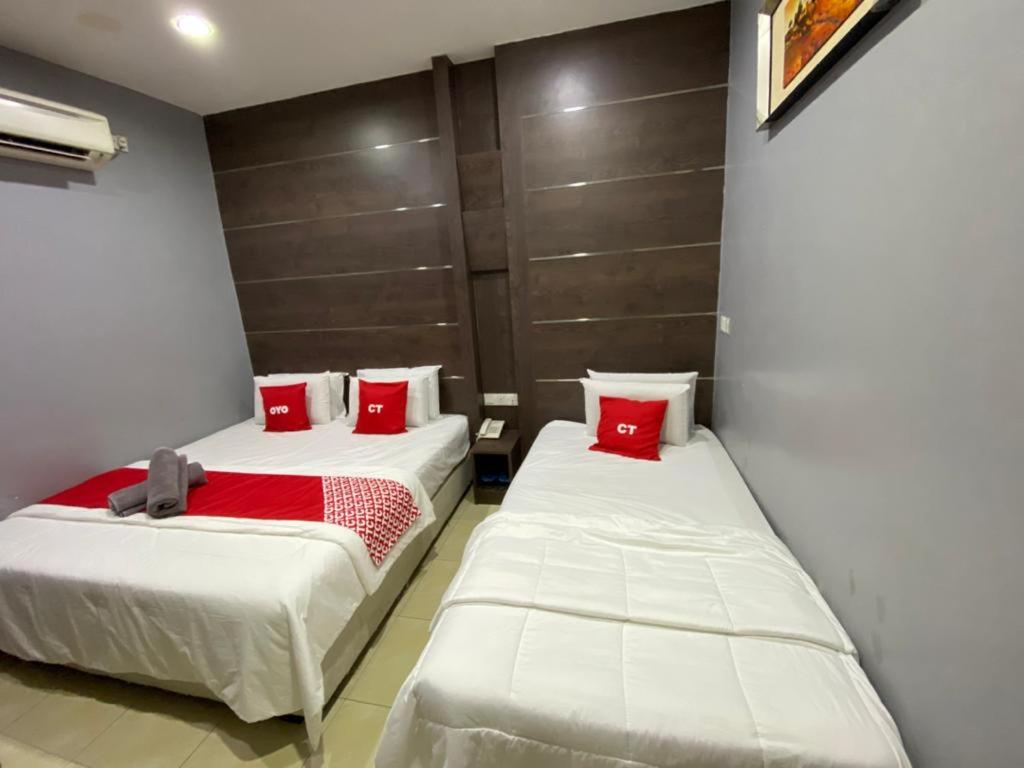Postel nebo postele na pokoji v ubytování Ct Hotel
