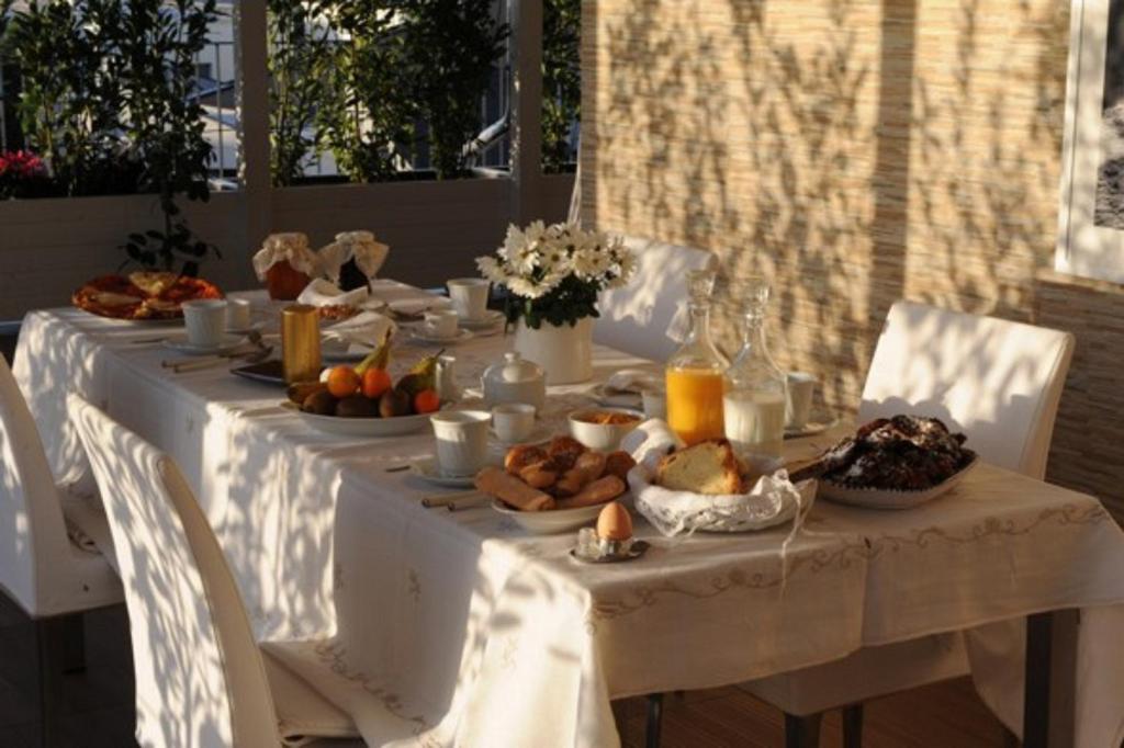 a white table with food on top of it at B&B Il Cielo Sui Sassi in Matera