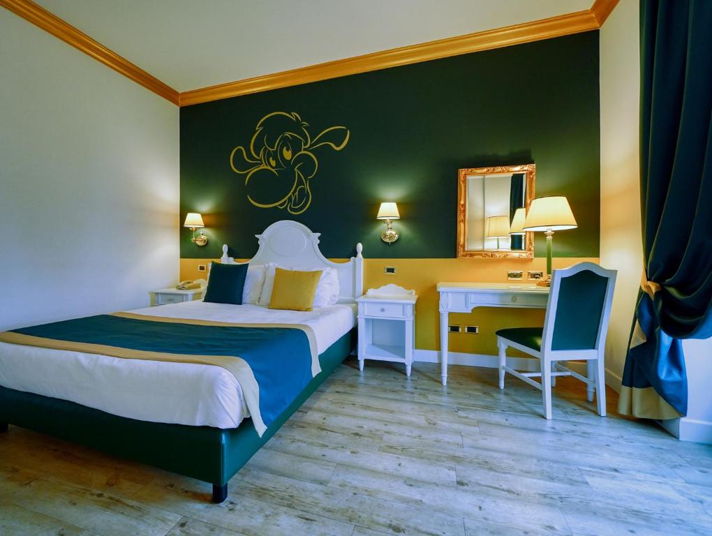 Postel nebo postele na pokoji v ubytování Gardaland Hotel
