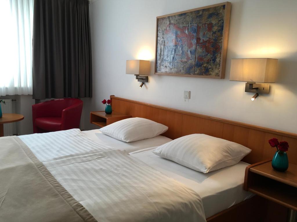 Postel nebo postele na pokoji v ubytování Hotel Francais