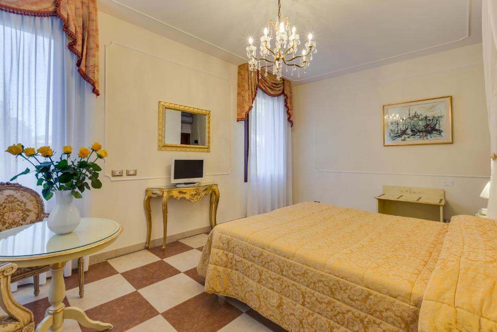 Postel nebo postele na pokoji v ubytování Hotel Bernardi Semenzato