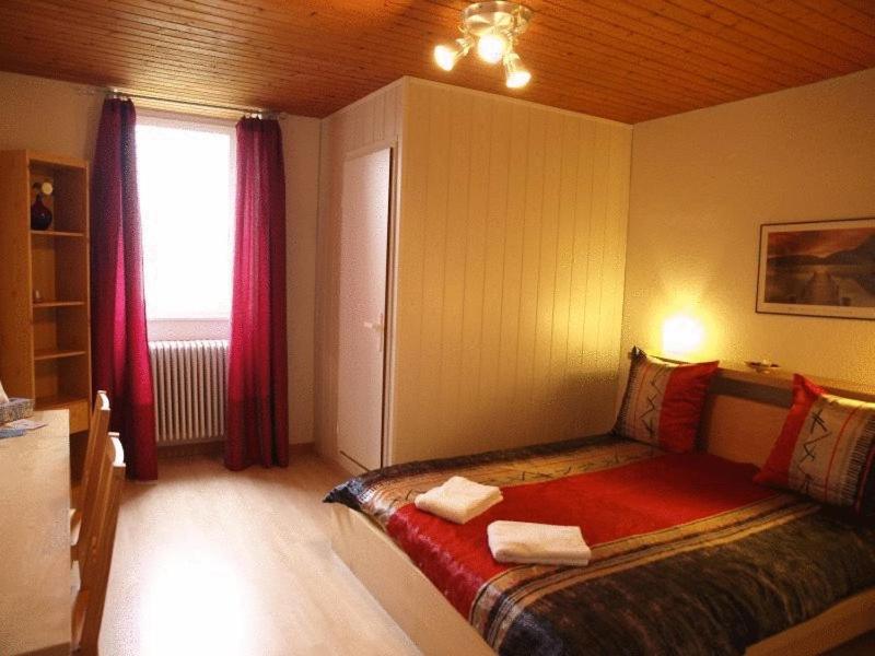 Postel nebo postele na pokoji v ubytování Hôtel Garni Villa Carmen