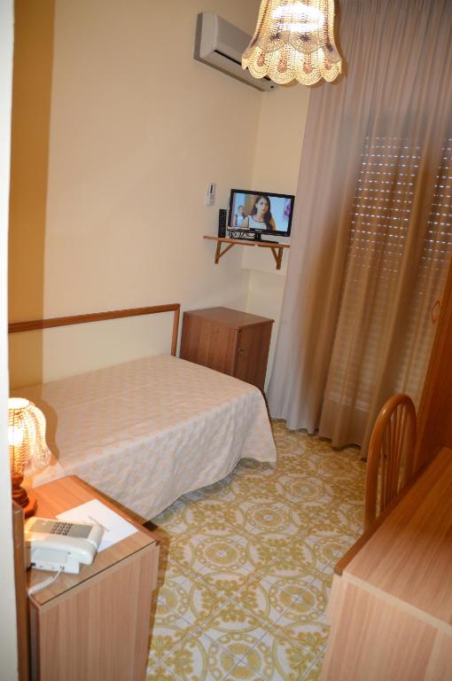 Postel nebo postele na pokoji v ubytování Hotel Virgilio