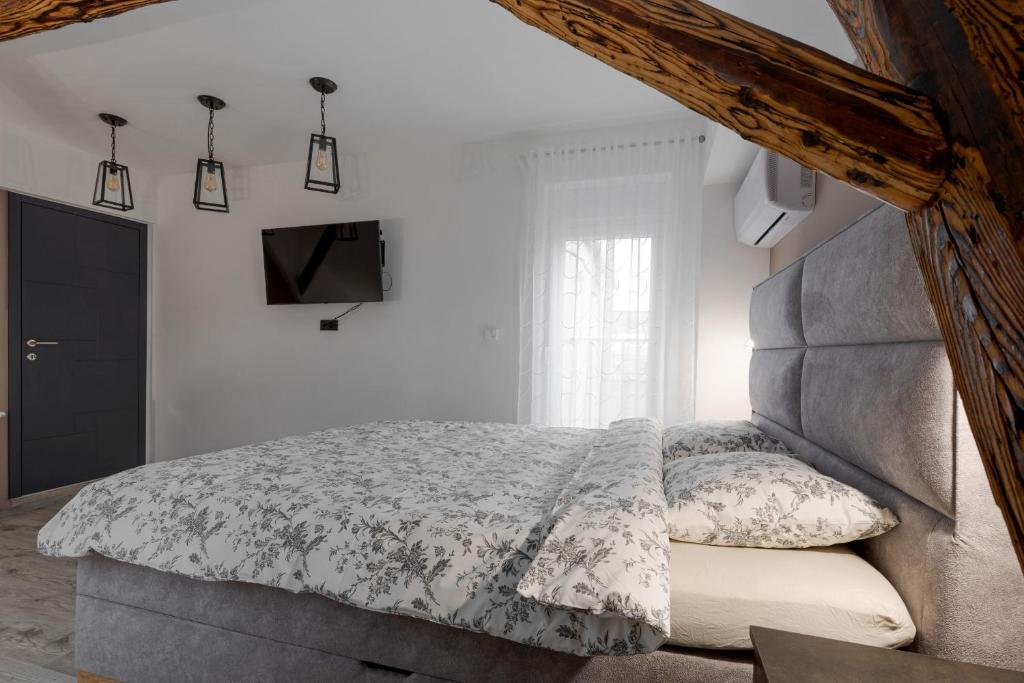 Posteľ alebo postele v izbe v ubytovaní Apartman DOWNTOWN DL