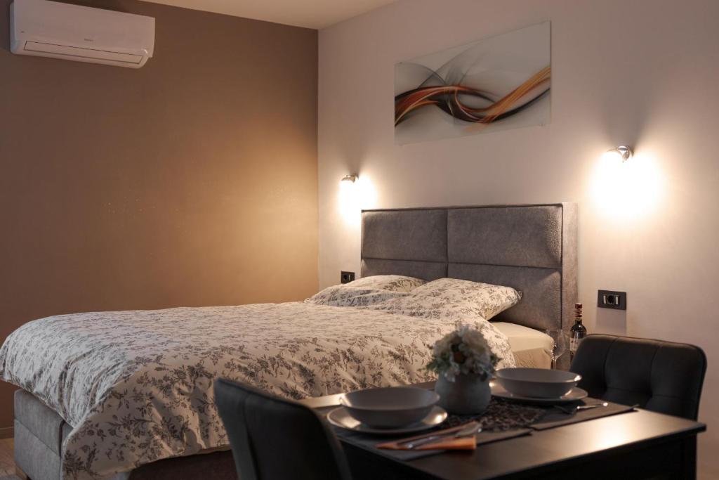 Posteľ alebo postele v izbe v ubytovaní Apartman DOWNTOWN DL