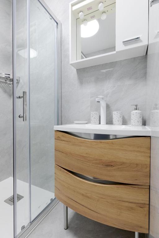 Kúpeľňa v ubytovaní Apartman DOWNTOWN DL